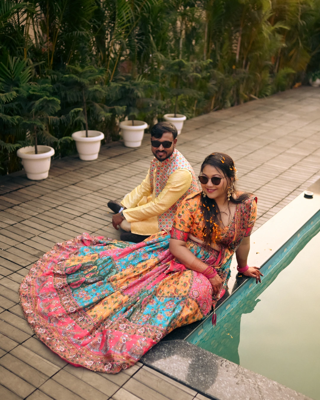 Cool Indian couple during haldi by the pool